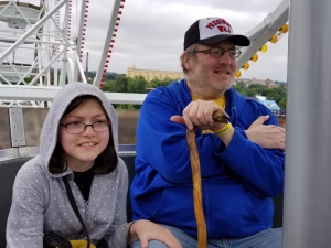 Man & his daughter on a Ferris wheel